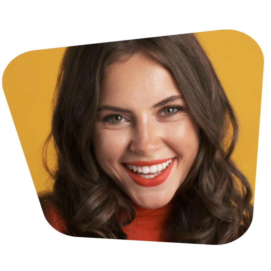 Portrait of beautiful smiling brunette girl with red lips joyfully looking in camera over colorful background